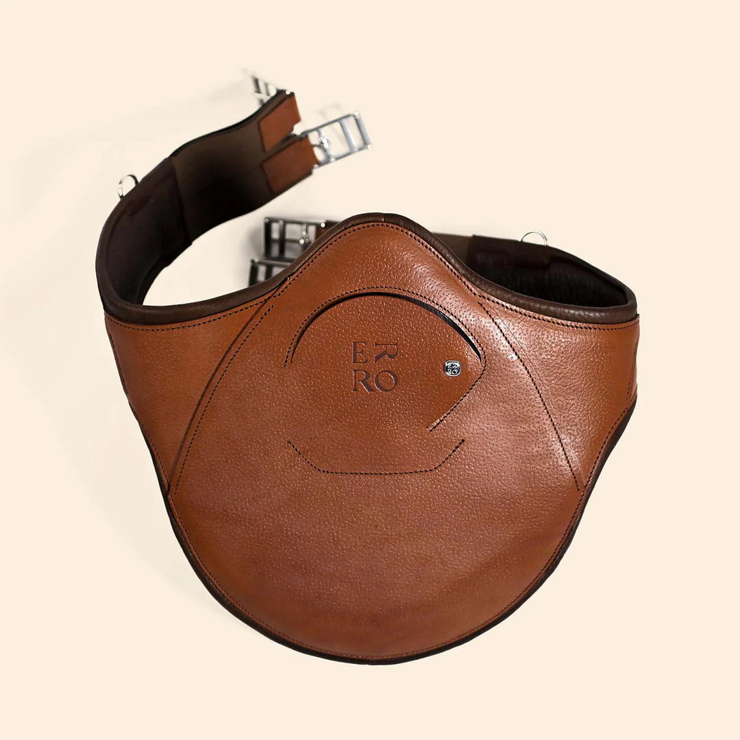 Brown leather belt with a visible brand logo on a beige background