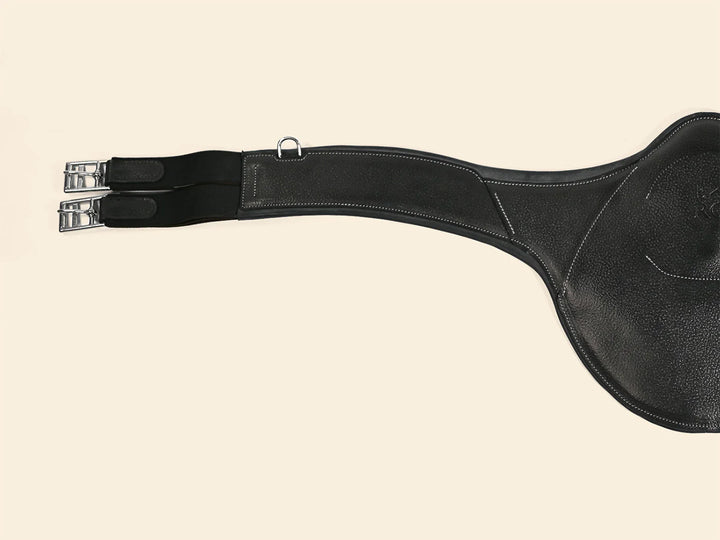 Black leather saddle with girth on a beige background
