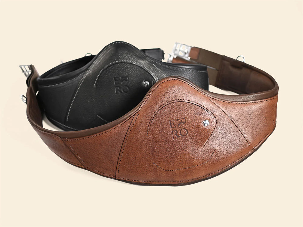 Brown and black leather shoulder straps with 'B & R' branding on a beige background